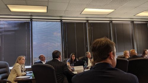 June 19, 2019, Atlanta - Lauren Holcomb (seated far left) has been appointed executive director of the State Charter Schools Commission. She attended a petition hearing in June for a charter school proposal. TY TAGAMI/AJC
