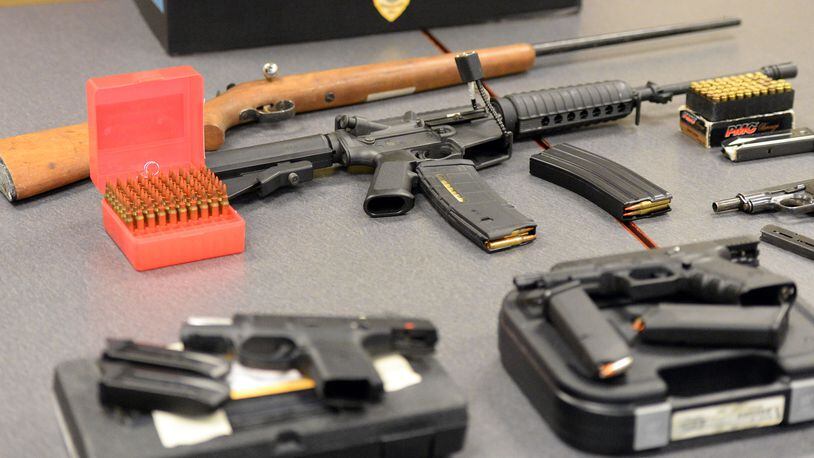 Guns confiscated by the DeKalb County State Court Probation Department from owners convicted of misdemeanor domestic violence. KENT D. JOHNSON/ kdjohnson@ajc.com