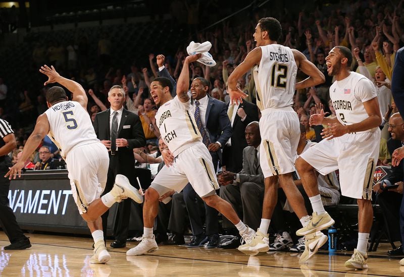**** VISUAL LEDE **** 031616 Atlanta: Georgia Tech guard Corey Heyward (from left) and the bench Tadric Jackson, Quinton Stephens, and Adam Smith react as he hits a three pointer near the end of the game on the way to beating Houston 81-62 during their first round NIT basketball game on Wednesday, March 16, 2016, in Atlanta. Curtis Compton / ccompton@ajc.com