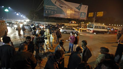 Pakistani media and residents gather at Benazir Bhutto International Airport following a report that a passenger plane from Chitral, in the country's north, had crashed near a village near the town of Havelian, in Islamabad, Pakistan, Wednesday, Dec. 7, 2016. Pakistan International Airlines said that the ATR-42 aircraft carrying around 40 passengers and crew lost touch with the control tower and that all resources are being mobilized. (AP Photo/Anjum Naveed)
