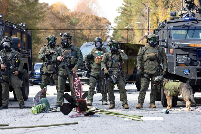 Police stand by after a clash with protestors demonstrating against Atlanta’s public training safety center in Atlanta on Monday, November 13, 2023. (Arvin Temkar / arvin.temkar@ajc.com)