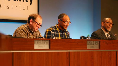 From left, DeKalb County Board of Education vice chairman Marshall Orson, chairman Michael Erwin and former Superintendent Steve Green work during a recent board meeting. (AJC FILE PHOTO)