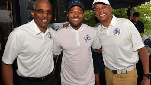 T. Dallas Smith & Co. rented out the College Park Golf Course on Aug. 19 for its founder's birthday, doubling as a charity event. From left to right: COO Dexter Warrior, President Leonte Benton and CEO T. Dallas Smith.