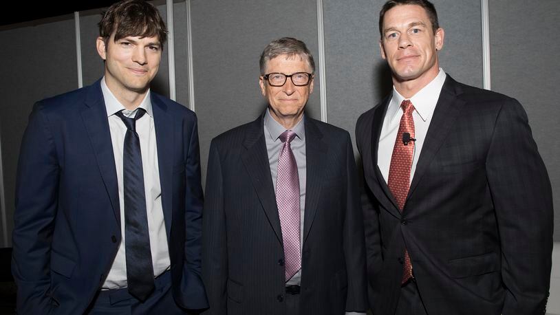 Ashton Kutcher, Bill Gates and John Cena at the Rotary International annual international meeting, which is being held in Atlanta. On Monday, the Gates Foundation and Rotary committed $450 to eradicate polio.