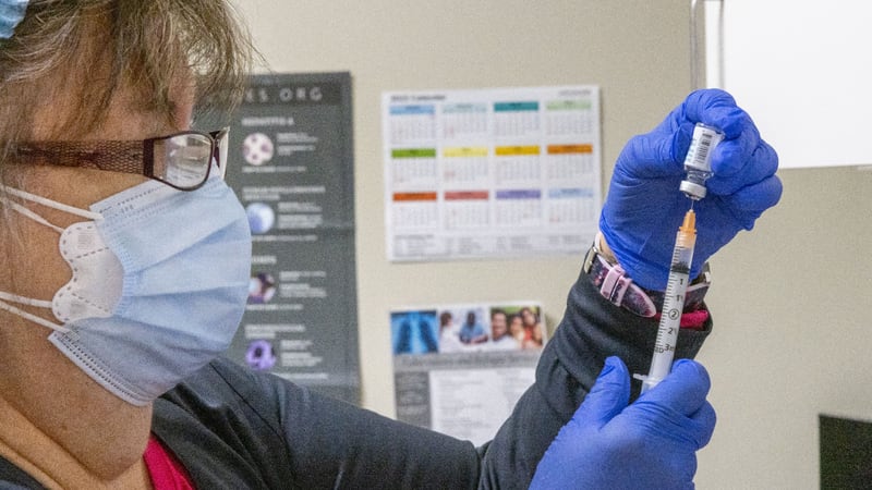 Elizabeth Vogel MN MPH fills syringes with the Monkeypox vaccination Friday morning at the N. DeKalb Health Center in Chamblee, August 5, 2022. (Steve Schaefer / steve.schaefer@ajc.com)