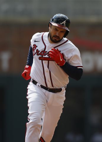 Atlanta Braves' Travis d'Arnaud homers during the second inning of game one of the baseball playoff series between the Braves and the Phillies at Truist Park in Atlanta on Tuesday, October 11, 2022. (Jason Getz / Jason.Getz@ajc.com)