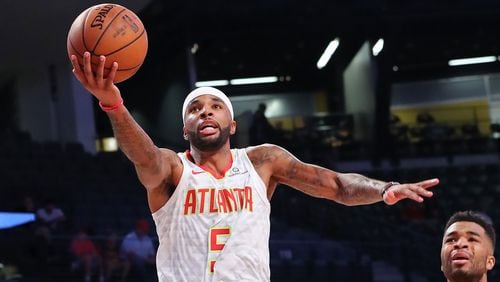 Hawks Malcolm Delaney goes to the basket against the Grizzlies.   Curtis Compton/ccompton@ajc.com