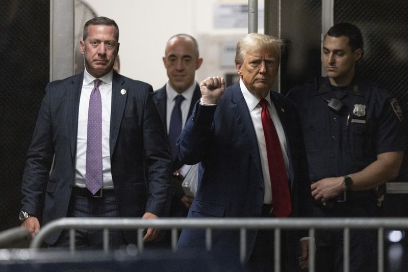 Former President Donald Trump returns from a break at Manhattan criminal court in New York, Thursday, April 25, 2024. (Jeenah Moon/Pool Photo via AP)