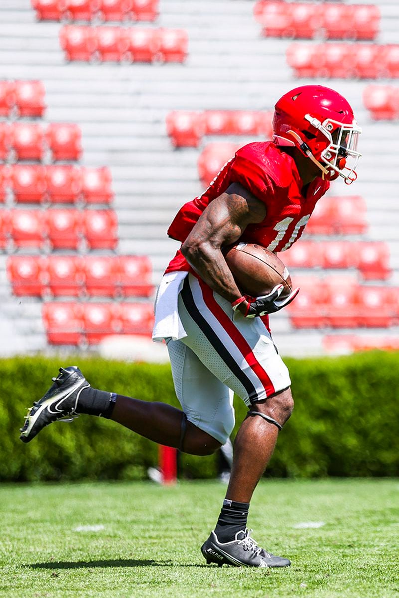 Georgia wide receiver Kearis Jackson (10) runs with the ball during the Bulldogs’ practice Saturday, April 3, 2021, on Dooley Field at Sanford Stadium in Athens. (Tony Walsh/UGA)