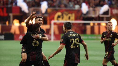Atlanta United midfielder Thiago Almada celebrates with teammates after scoring the team's first goal during the first half at Mercedes Benz Stadium in an MLS game between Atlanta United and the New Egland Revolution on Sunday, May 15, 2022. Thursday, May 12, 2022. Miguel Martinez / miguel.martinezjimenez@ajc.com