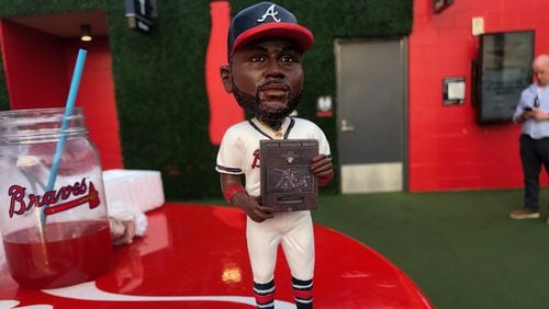 The Michael Harris II bobblehead poses upon a tabletop in Truist Park Aug. 22, 2023, the day the figurines were given to fans as they entered the stadium. (Ken Sugiura/AJC)