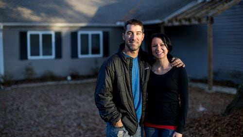 Andrew and Sarah Oliver pose for a photo at their new home, Wednesday, Dec. 14, 2016, in Acworth, Ga. Branden Camp/Special