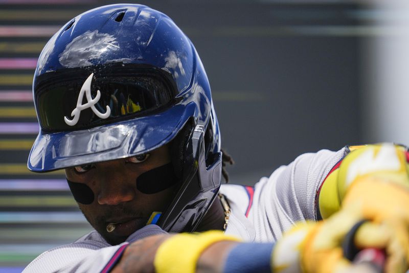 Atlanta Braves' Ronald Acuña Jr. warms up before a baseball game against the Los Angeles Dodgers in Los Angeles, Sunday, May 5, 2024. (AP Photo/Ashley Landis)