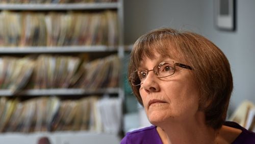 Janet Cosper is hopeful that proposed changes will allow her to collect her husband’s pension. Hal Cosper worked more than 20 years for the City of Marietta as a building inspector. BRANT SANDERLIN/BSANDERLIN@AJC.COM