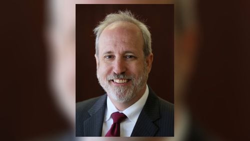 Stefan Ritter, the executive director of the state ethics commission, was suspended with pay Tuesday. An investigation will look into whether he misused his computer.