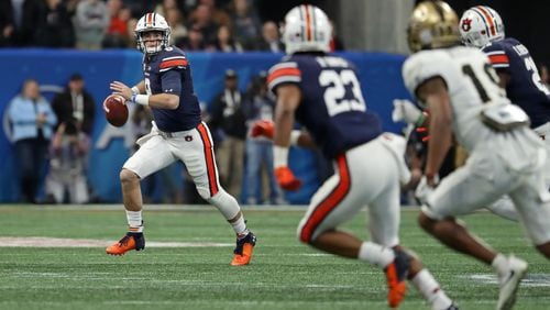 Auburn Tigers quarterback Jarrett Stidham (8) looks downfield to pass during the first quarter against the UCF Knights during the Chick-fil-A Peach Bowl at the Mercedes-Benz Stadium Monday, Jan. 1, 2018, in Atlanta.