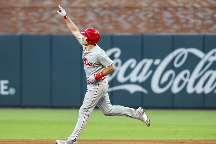 Philadelphia Phillies catcher J.T. Realmuto (10) signals a two-run home run against the Atlanta Braves during the second inning of the NLDS Game 2 In Atlanta on Monday, Oct. 9, 2023.   (Miguel Martinez / Miguel.Martinezjimenez@ajc.com)