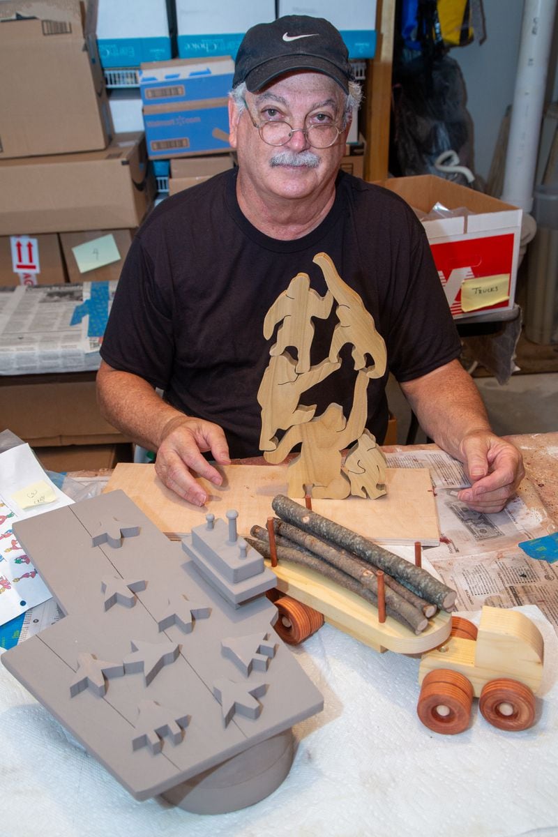 Jon Saulson with some of his woodworking creations. PHIL SKINNER FOR THE ATLANTA JOURNAL-CONSTITUTION.