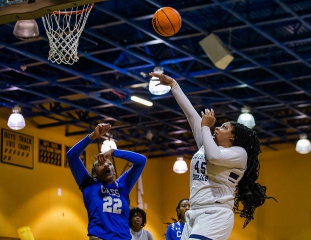 Taylor Christmas (45), center for South Dekalb High School, shoots over a block by Justice Bennett (22), center for Cass High School, during the South Dekalb vs. Cass girls basketball playoff game on Friday, February 26, 2021, at South Dekalb High School in Decatur, Georgia. South Dekalb defeated Cass 72-46. CHRISTINA MATACOTTA FOR THE ATLANTA JOURNAL-CONSTITUTION
