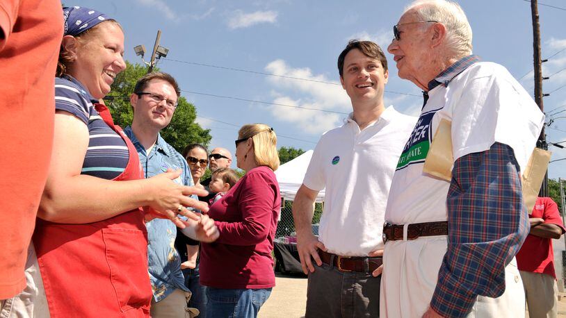 100508 Atlanta -- Former President Jimmy Carter (far right) and grandson Jason Carter (second from right) speak to Belinda Wernau (far left) of Concord and Rockwell Hunter (second from left) of Reynoldstown as they campaign at the East Lake Farmers Market in Atlanta Saturday, May 8, 2010. Jason Carter is a candidate in the special election being held Tuesday, May 11, for Georgia Senate District 42. Bita Honarvar, bhonarvar@ajc.com Former President Jimmy Carter (far right) and grandson Jason Carter (second from right) campaign at the East Lake Farmers Market in 2010 during the younger Carter’s run for state Senate. Bita Honarvar, bhonarvar@ajc.com