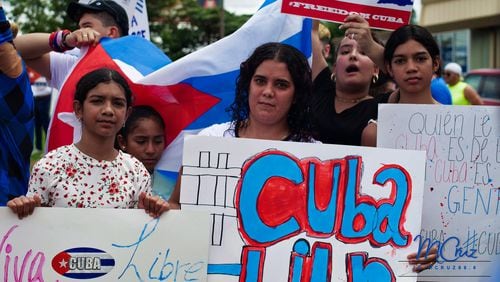 Protesters gathered in Sandy Springs on Sunday, July 18th, 2021, in a show of solidarity for Cuba.
