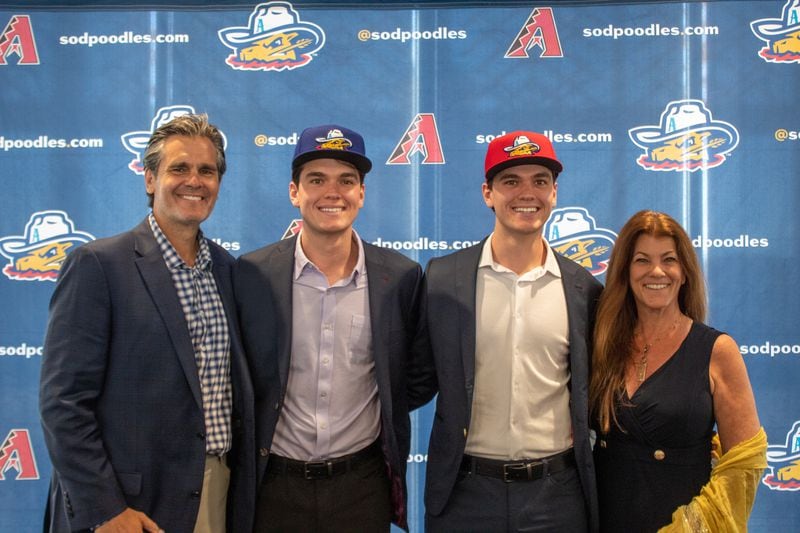 Twin brothers Stefan Caray (second from left) and Chris Caray (third from left) are joined by their parents Chip and Susan Caray at Hodgetown Stadium in Amarillo, Texas. (Photo by Isaac Galan / Special to the AJC)