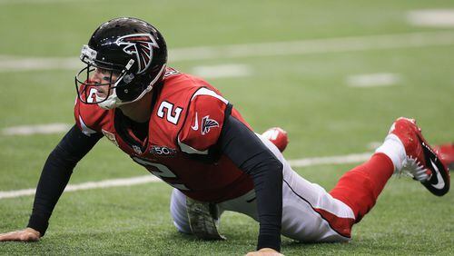 Falcons quarterback Matt Ryan is knocked to the turf after attempting a pass against the Colts during the fourth quarter in a football game on Sunday, Nov. 22, 2015, in Atlanta. The Falcons lost to the Colts who came back in the fourth quarter to win the game 24-21. Curtis Compton / ccompton@ajc.com