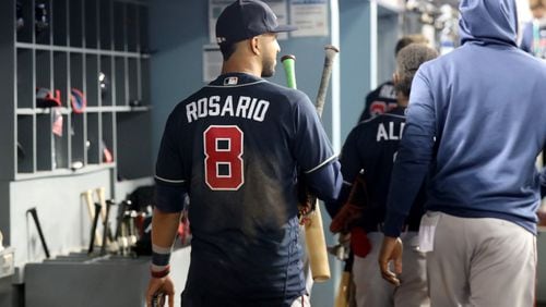 Braves left fielder Eddie Rosario and teammates leave the dugout after their 11-2 loss to the Los Angeles Dodgers in game 5 at the National League Championship Series at Dodger Stadium, Thursday October 21, 2021, in Los Angeles, Ca. Curtis Compton / curtis.compton@ajc.com
