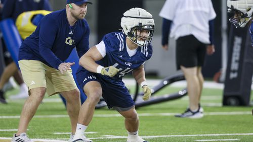Georgia Tech assistant coach Tyler Santucci watches as linebacker Kyle Efford (44) prepares to perform a drill during a spring practice session in March. (Jason Getz / jason.getz@ajc.com)