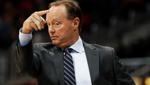 Atlanta Hawks head coach Mike Budenholzer motions to his players in the first half of an NBA basketball game against the Detroit Pistons, Friday, Dec. 2, 2016, in Atlanta. (AP Photo/John Bazemore)