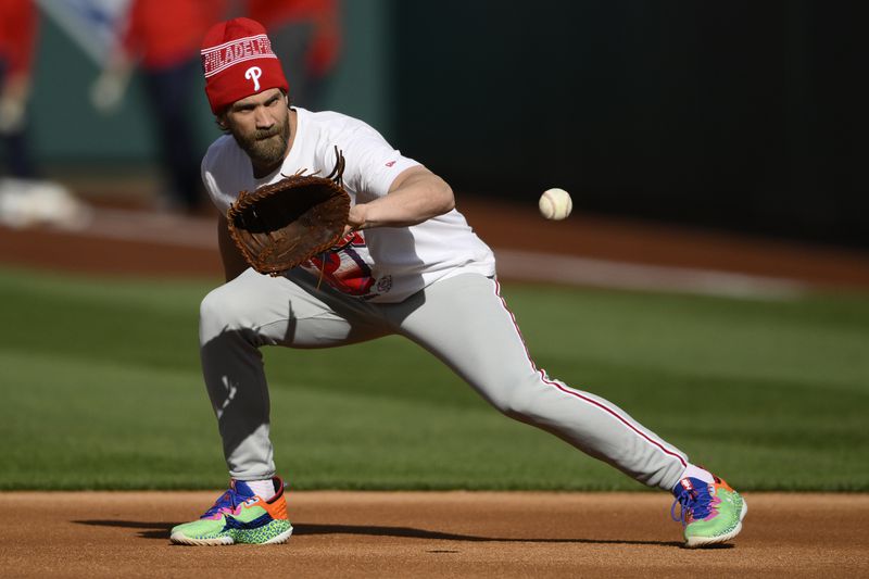 Philadelphia Phillies first baseman Bryce Harper works out before a baseball game against the Washington Nationals, Friday, April 5, 2024, in Washington. (AP Photo/Nick Wass)
