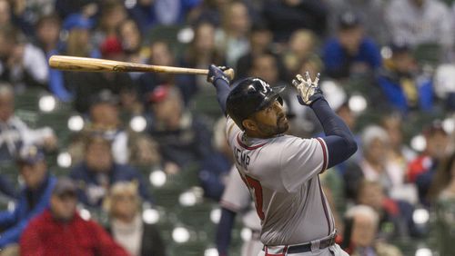 Braves’ Matt Kemp watches his third home run fly over the right field wall during the eighth inning Saturday. (AP Photo/Tom Lynn)