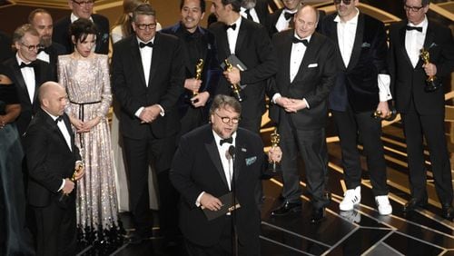 Guillermo del Toro and the cast and crew of "The Shape of Water" accept the award for best picture at the Oscars on Sunday, March 4, 2018, at the Dolby Theatre in Los Angeles. Photo by Chris Pizzello/Invision/AP