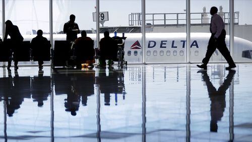 A Delta jet at Hartsfield-Jackson Atlanta International Airport. Delta is buying a 10 percent stake in European partner Air France-KLM. (AP Photo/David Goldman, File)
