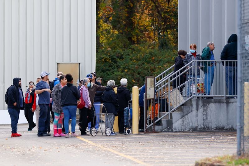 Clients wait in line for the Mini-Market to open at the Community Assistance Center (CAC) in Roswell on Tuesday, Nov. 14, 2023. The Community Center is a supplementary food program that serves the community to help with their food needs.

Miguel Martinez /miguel.martinezjimenez@ajc.com