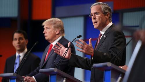 Jeb Bush, right, and Donald Trump at the Republican presidential debate hosted by Fox News in Cleveland, Aug. 6. After failing to directly confront Trump in the first debate, Bush and his aides are under pressure to create a memorable showdown Wednesday to match a newly aggressive tone on the campaign trail.