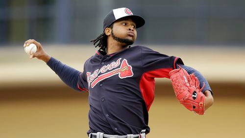 Atlanta Braves starting pitcher Ervin Santana throws during the third inning of a spring exhibition baseball game against the Detroit Tigers in Lakeland, Fla., Tuesday, March 25, 2014. (AP Photo/Carlos Osorio)