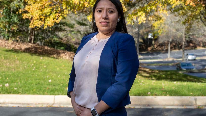 11/24/2020 �  Atlanta, Georgia � Jessica Colotl stands for a portrait outside of her employers office in Sandy Springs, Tuesday, November 24, 2020. Colotl has worked as an immigration paralegal for more than 4 years. (Alyssa Pointer / Alyssa.Pointer@ajc.com)