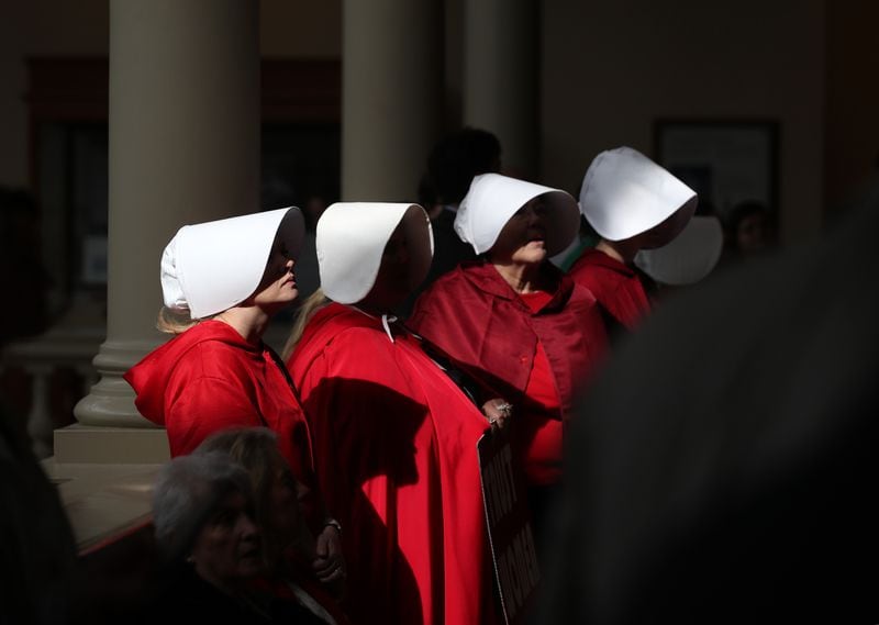 March 14, 2019 - Atlanta, Ga: Women with the Handmaid Coalition of Georgia stand in the hallways outside of room 450 protesting HB481 where there was a committee meeting about the bill at the Georgia Capitol Thursday, March 14, 2019 in Atlanta. (JASON GETZ/SPECIAL TO THE AJC)