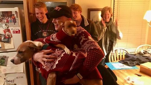 After eight months of chemo and two surgeries, Michael was released from care and hopefully cured as he came home for Christmas 2017. He was happy to see his dapper dogs. (Photo by Phil Huelson)