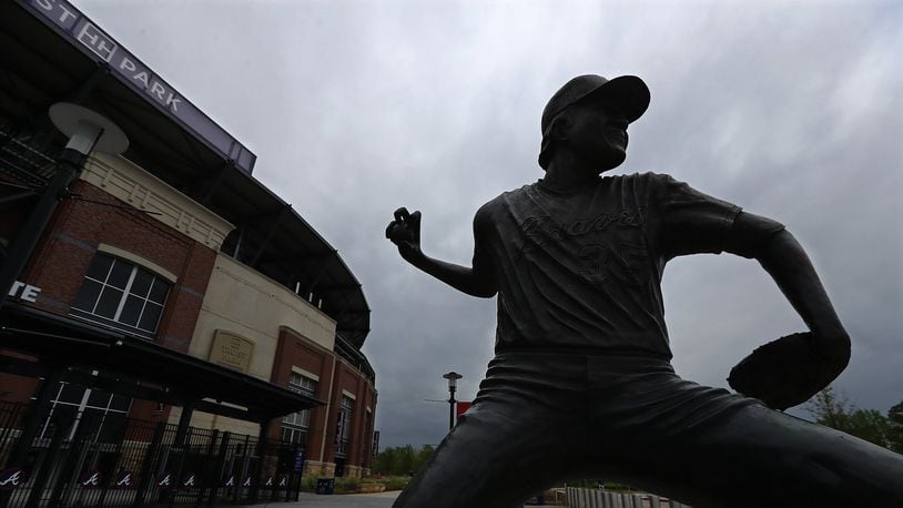 A statue of Hall of Fame pitcher Phil Niekro, the winningest knuckleball pitcher in major league history, adorns the Atlanta Braves' Truist Park Tuesday, March 31, 2020, in Atlanta. Niekro died Saturday, Dec. 26, 2020. (Curtis Compton/Curtis.Compton@ajc.com)