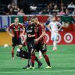Atlanta United forward Giorgos Giakoumakis (7) leaves the field with the help of a team doctor during the second half against the Chicago Fire at Mercedes-Benz Stadium on Sunday, March 31, 2024.
 Miguel Martinez / miguel.martinezjimenez@ajc.com