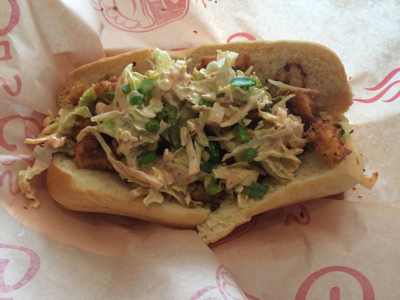 The Sichuan-style fried chicken po’boy at Gu’s Kitchen on Buford Highway comes topped with spicy coleslaw. CONTRIBUTED BY WENDELL BROCK