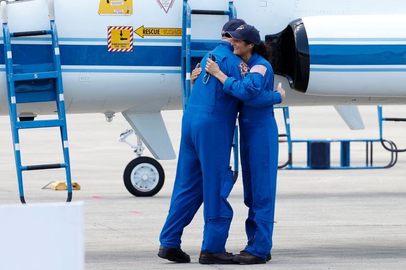 NASA astronauts Suni Williams,right, and Butch Wilmore hug after they arrived at the Kennedy Space Center, Thursday, April 25, 2024, in Cape Canaveral, Fla. The two test pilots will launch aboard Boeing's Starliner capsule atop an Atlas rocket to the International Space Station, scheduled for liftoff on May 6, 2024. (AP Photo/Terry Renna)