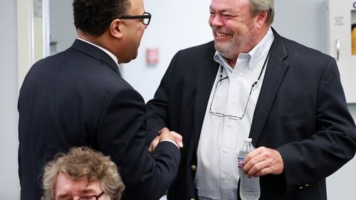 July 11, 2019 Fort Mac: Fort Mac LRA board chairman Cassius Butts (left) greets developer Stephen Macauley (right) as he arrives for the McPherson Implementing Local Redevelopment Authority Board Meeting at Fort Mac LRA on Thursday, July 11, 2019, in Atlanta. Curtis Compton/ccompton@ajc.com