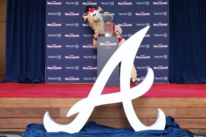 Atlanta Braves mascot Blooper accommodates the 2021 World Champions Trophy during the first stop of the World Champions Trophy Tour on Tuesday, February 15, 2022, at Colony Square in Midtown. Miguel Martinez for The Atlanta Journal-Constitution 