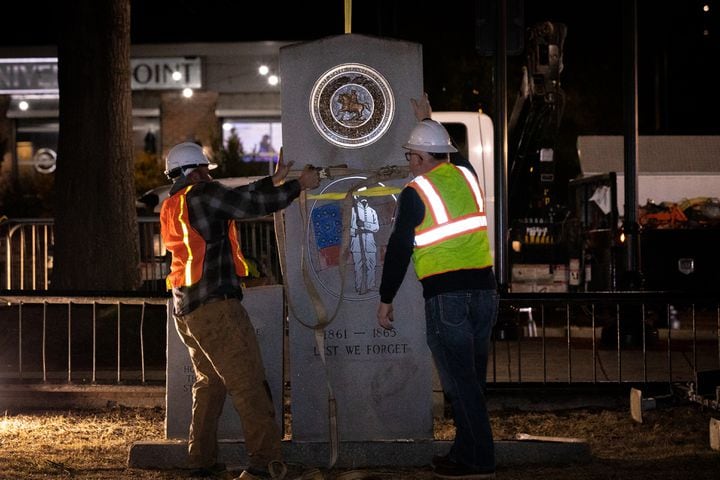 A crew works to remove a Confederate monument from its place on the grounds of the Gwinnett Historic Courthouse in Lawrenceville, Ga., on Thursday, Feb. 4, 2021. The Gwinnett County Board of Commissioners voted unanimously on January 19 to remove the monument, overturning the decision of their predecessors from almost three decades prior. In 1993, county commissioners gave permission for the monument to be installed at the request of the United Daughters of the Confederacy. (Casey Sykes for The Atlanta Journal-Constitution)