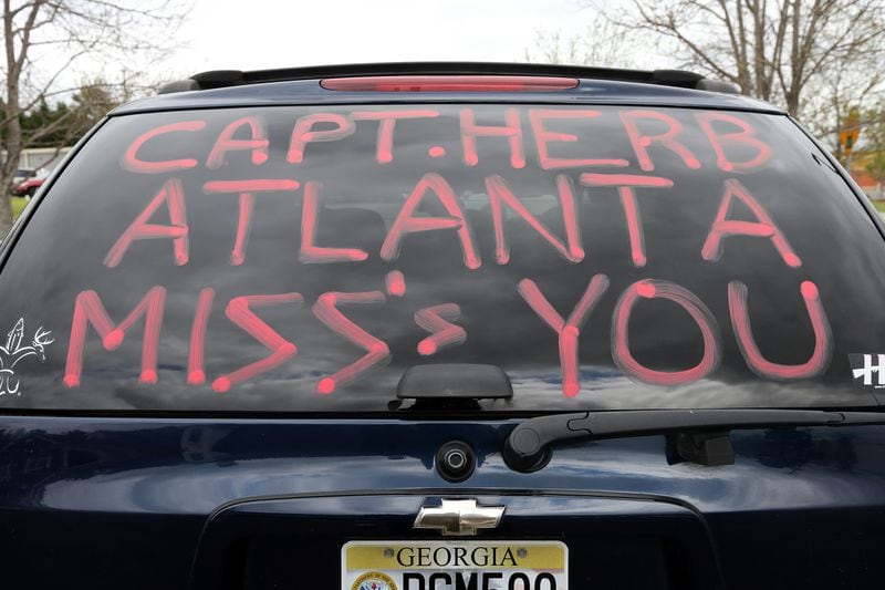 April 15, 2014 Douglasville: Chris Canady, who wrote a special message on the back of his truck, pulls into the visitation for Cpt. Herb Emory Tuesday afternoon April 15, 2014 in Douglasville. BEN GRAY / BGRAY@AJC.COM