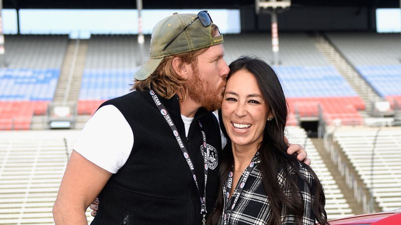 FORT WORTH, TX - NOVEMBER 05:  'Fixer Upper' stars Chip and Joanna Gaines pose with the Monster Energy NASCAR Cup Series AAA Texas 500 pace car at Texas Motor Speedway on November 5, 2017 in Fort Worth, Texas.  (Photo by Jared C. Tilton/Getty Images)