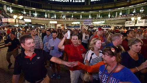 Georgia and Florida fans elebrate during an annual party at the Jacksonville Landing on the eve of the Georgia vs Florida game on Oct. 28, 2016.